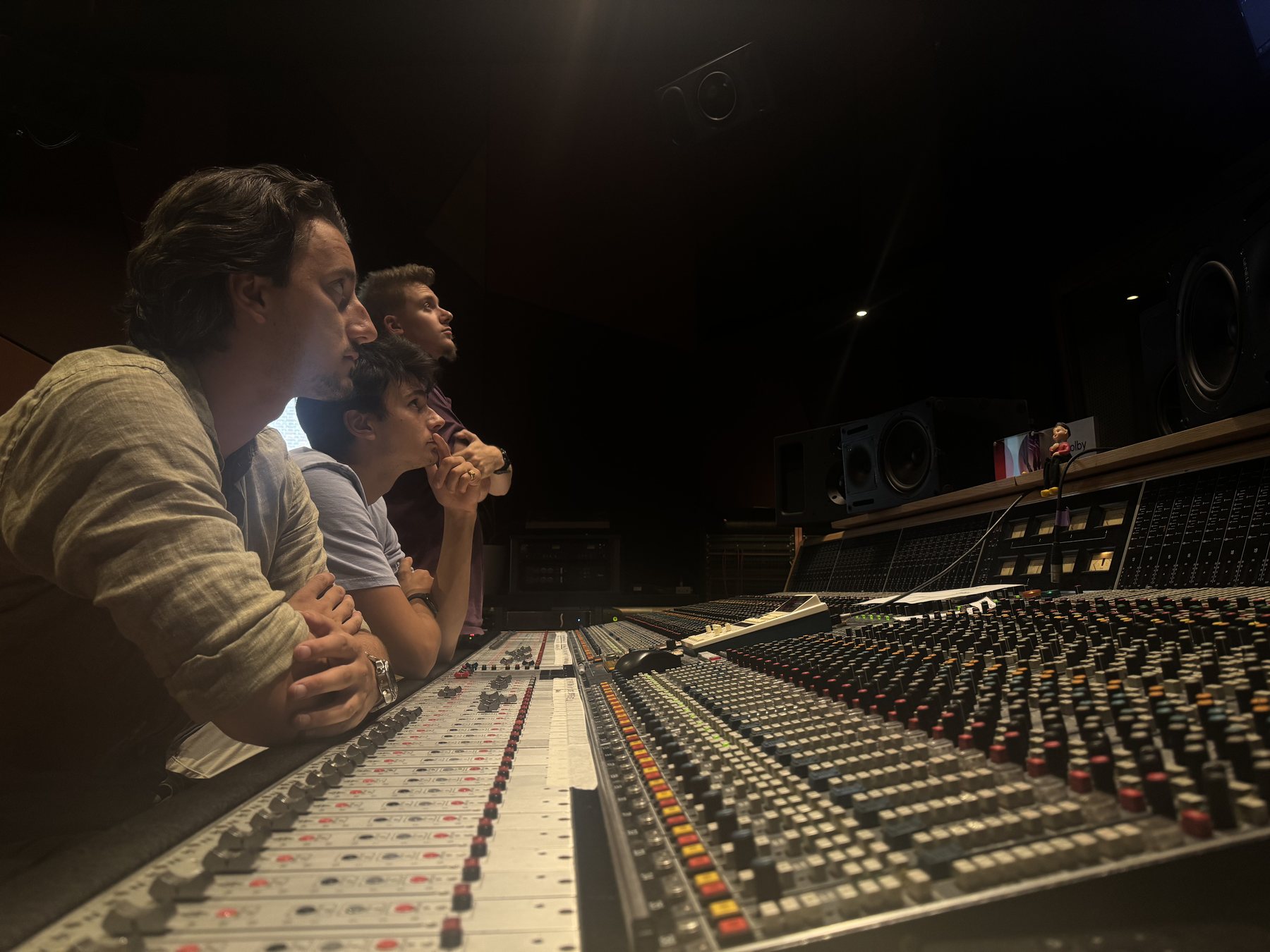 Group listening together at the console during the Dorsy session, image 10 of 11