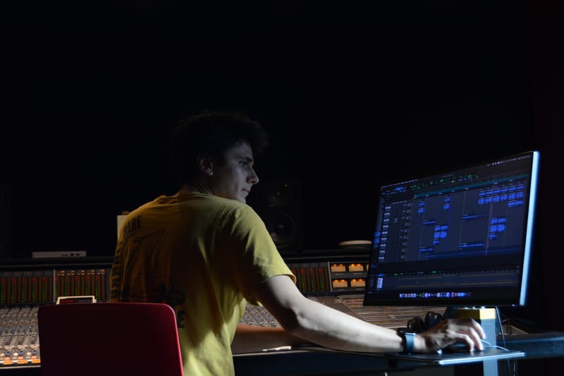 Erik Magnifico working in a recording studio